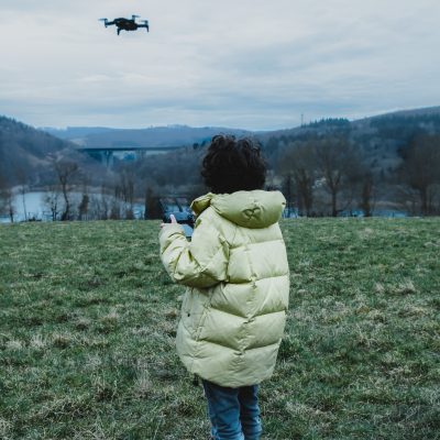 kid playing with the drone